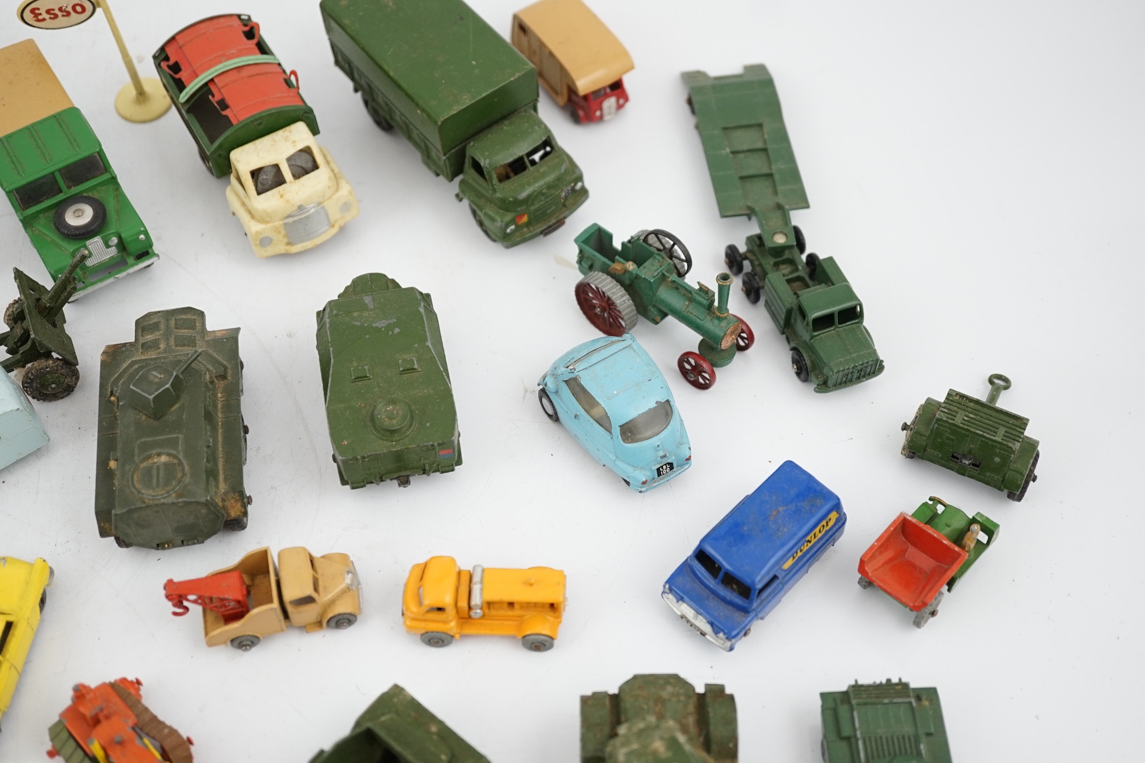 Thirty-eight diecast vehicles by Dinky Toys, Corgi Toys, Matchbox, etc. including a Spot-On BMW Isetta, military Dinky vehicles, Matchbox Series, etc.